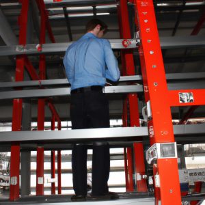 Person operating cantilever racking system