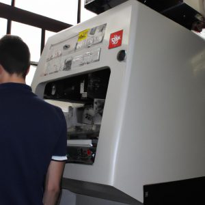 Person operating advanced industrial machinery