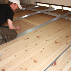 Person installing mezzanine flooring